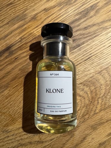 Customer's Klone Scent Collection bottle sitting on a wooden surface.