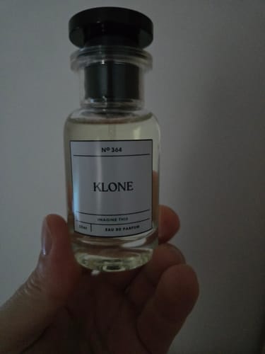 Customer's Klone Scents Collection bottle held in hand, clear glass with label reading No 364.