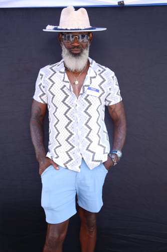 Customer's Paradise Breeze fragrance experience, worn by a stylish person against a black background.
